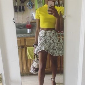 Floral white mini skirt with ruffle details